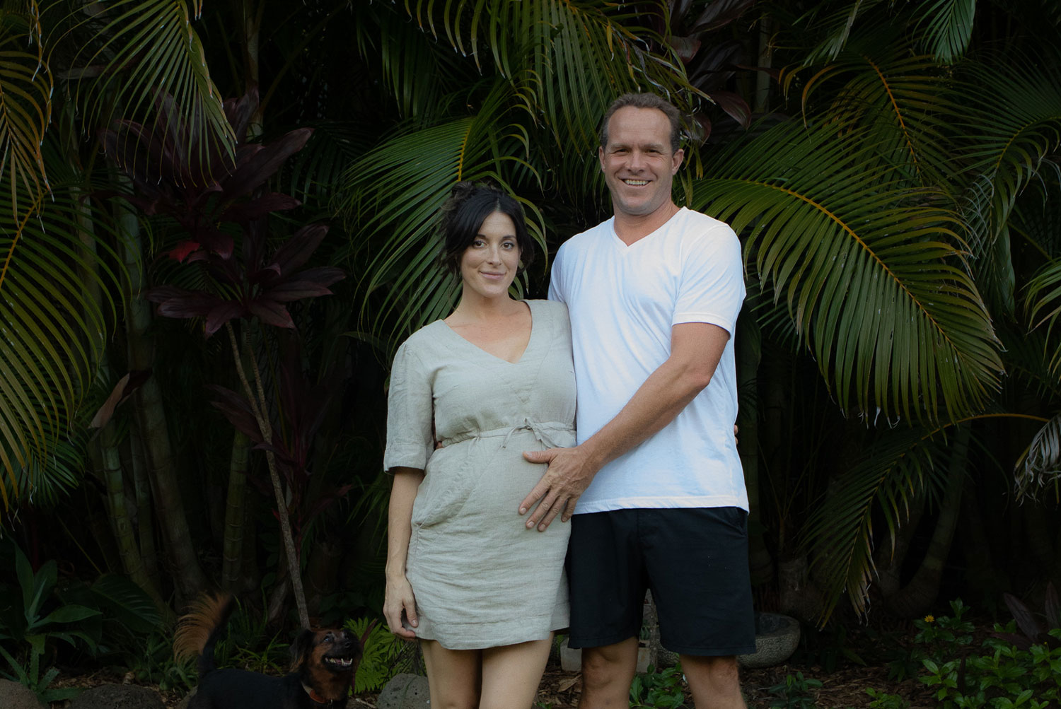 Kristal and Dylan Muhich standing in front of trees