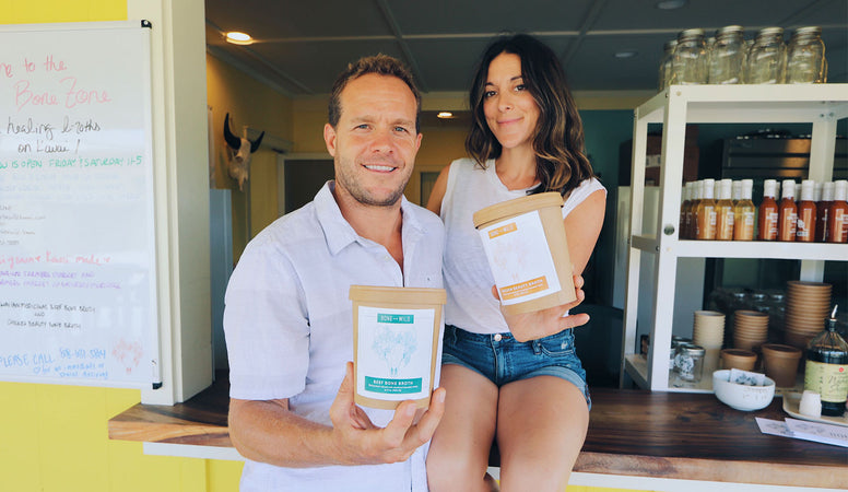 Kristal and Dylan Muhich holding cups of bone broth