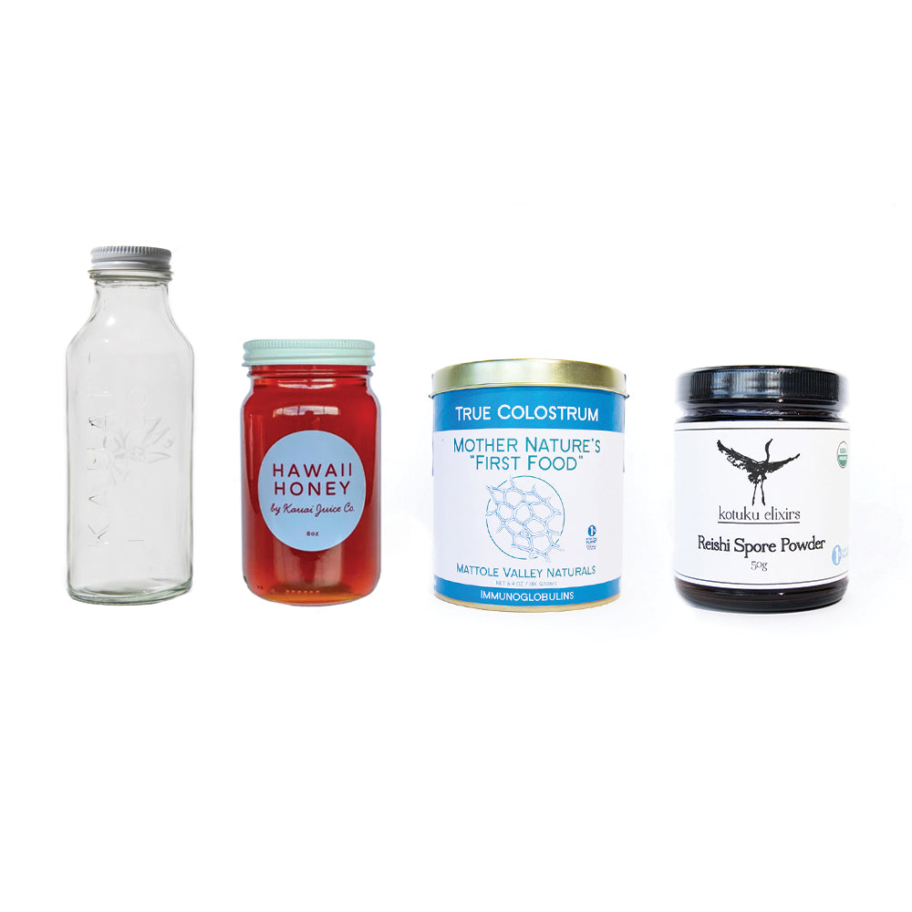 clear glass bottle, jar of hawaii honey, can of true colostrum, and jar of reishi spore powder