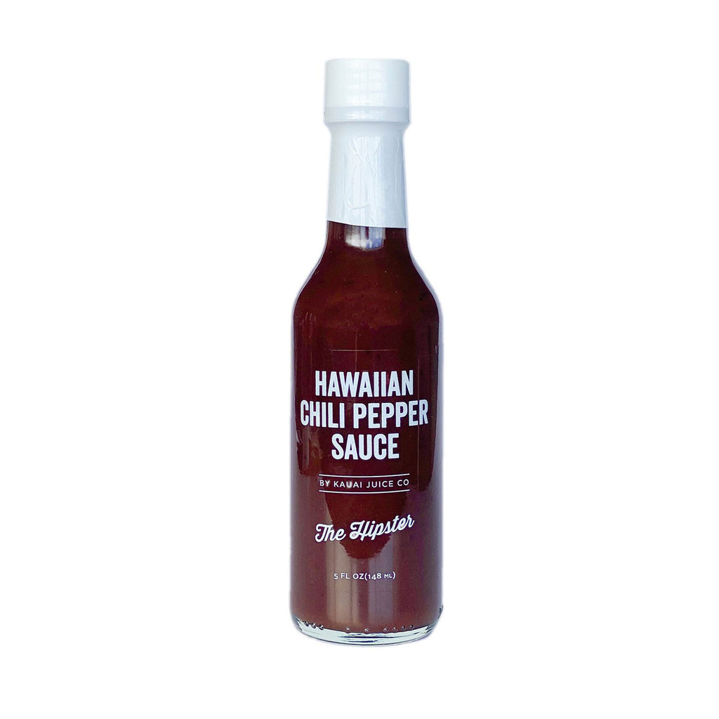 5 oz bottle of Hawaiian Chili Pepper sauce by Kauai Juice Co. In "The Hipster" flavor.