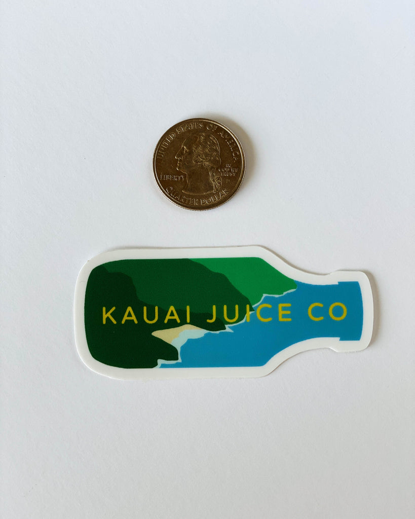 Kauai Juice co bottle sticker and a quarter