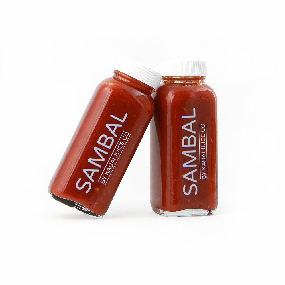 two bottles of sambal sauce by Kauai Juice Co